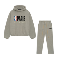 Fear of God Essentials NBA Paris Warm Heather Full set in grey, featuring a hoodie with NBA Paris Essentials logo and matching sweatpants, perfect exclusive clothing.