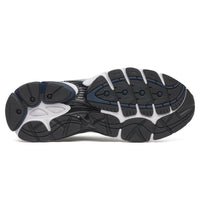 Saucony ProGrid Omni 9 Deep Navy sneakers viewed from below showing a black and navy rubber outsole with white traction details