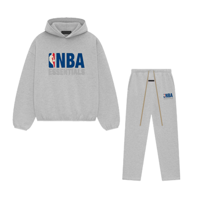 Light heather grey hoodie and sweatpants set featuring NBA Essentials branding in blue and red, designed for casual comfort in the Fear Of God Essentials NBA Light Heather Full set.